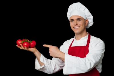 chef holding tomatoes